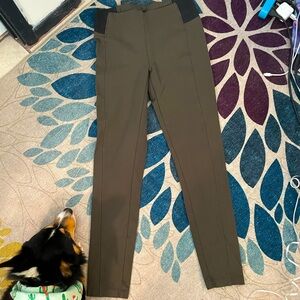 Olive green colored leggings or pants with stretch